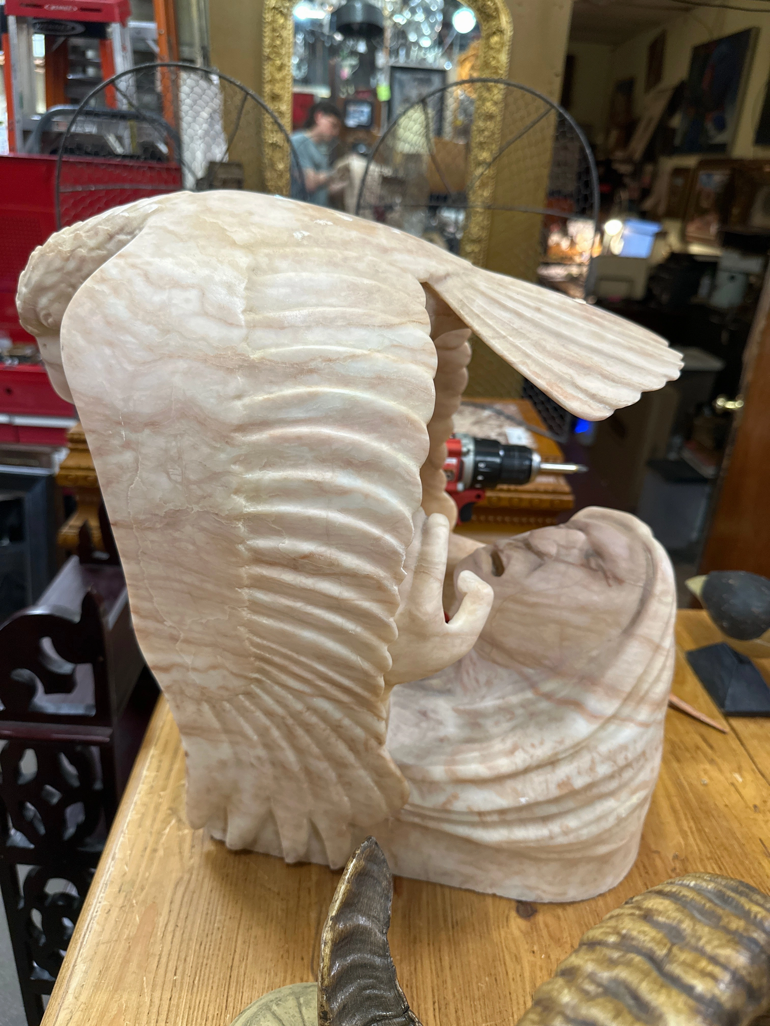 CARVED ALABASTER STAUE OF AN INDIAN HOLDING AN EAGLE