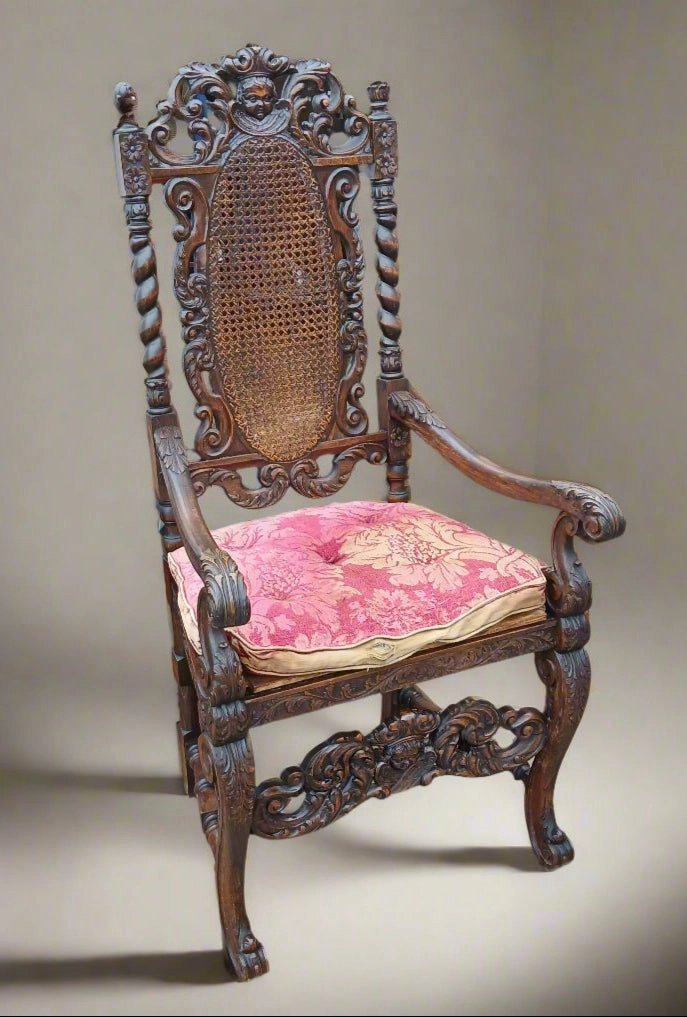 CARVED OAK BARLEY TWIST ARM CHAIR WITH CHERUB CREST