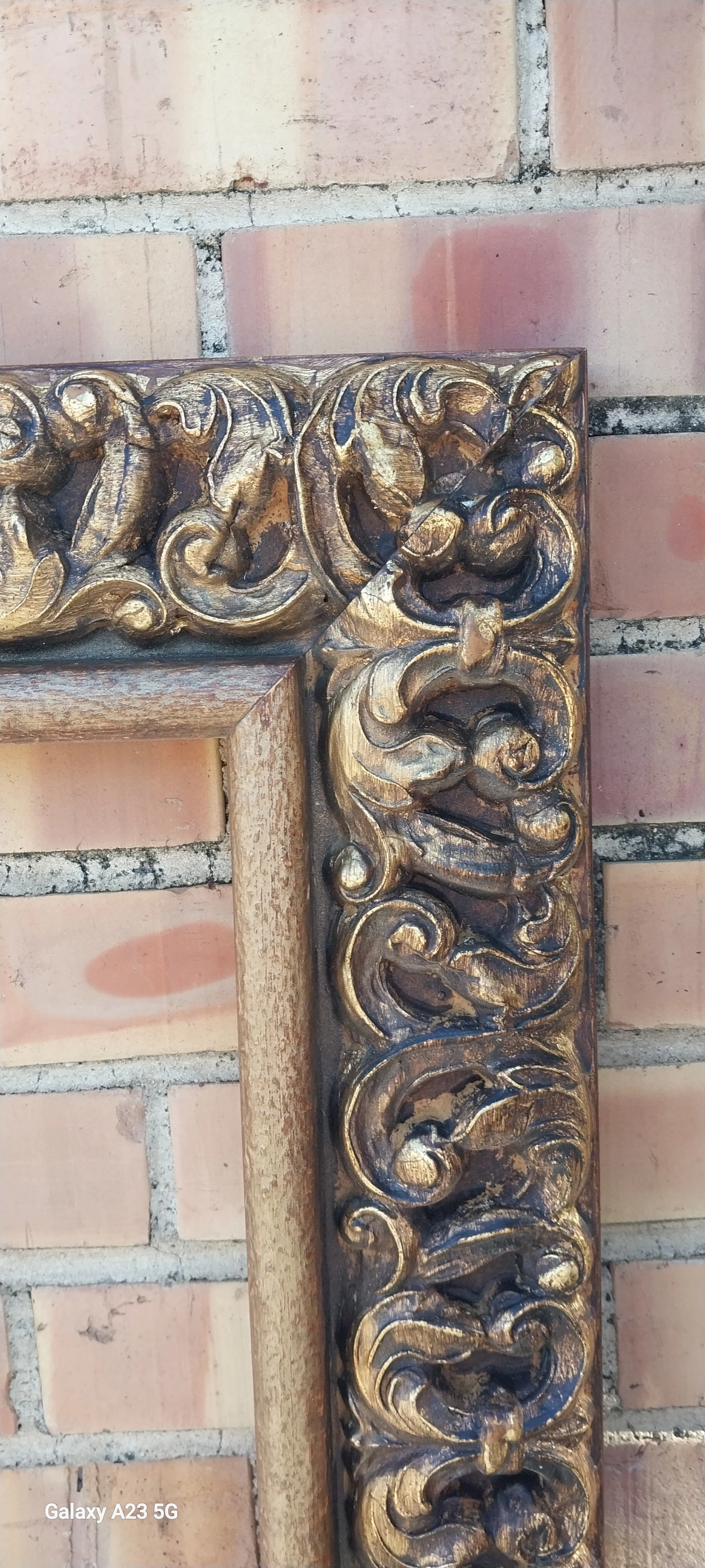LARGE CARVED WOOD AND COMPOSITION FRAME