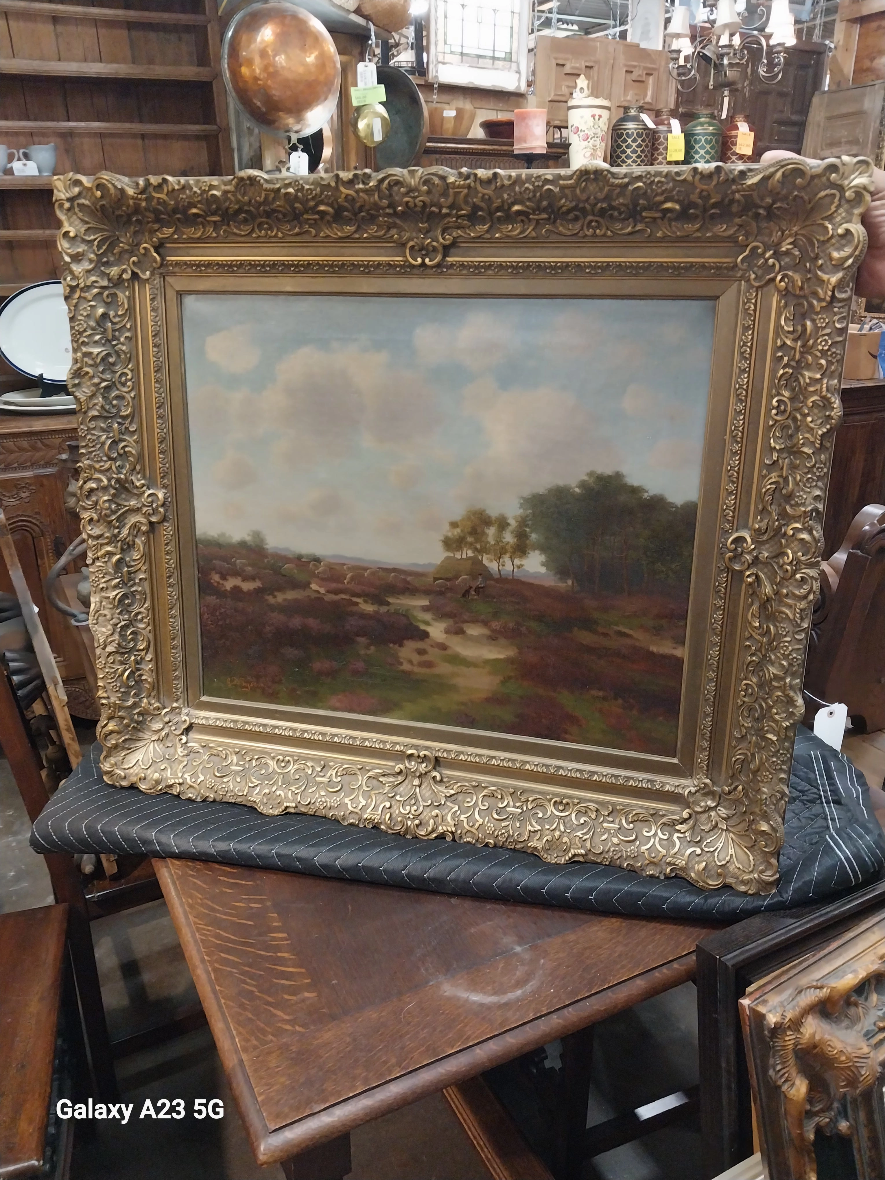 ORNATELY FRAMED LANDSCAPE OIL PAINTING WITH SHEEP