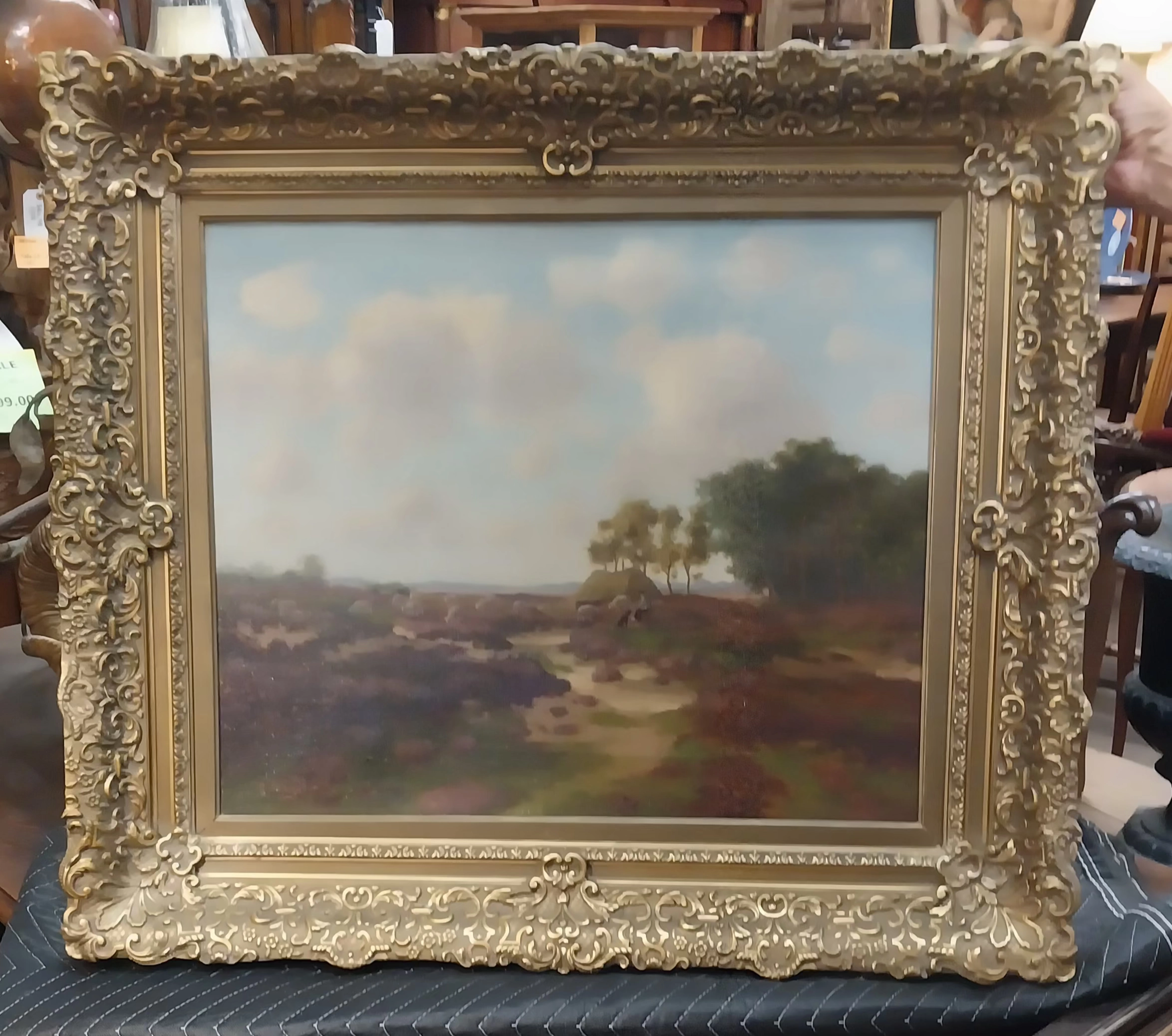 ORNATELY FRAMED LANDSCAPE OIL PAINTING WITH SHEEP