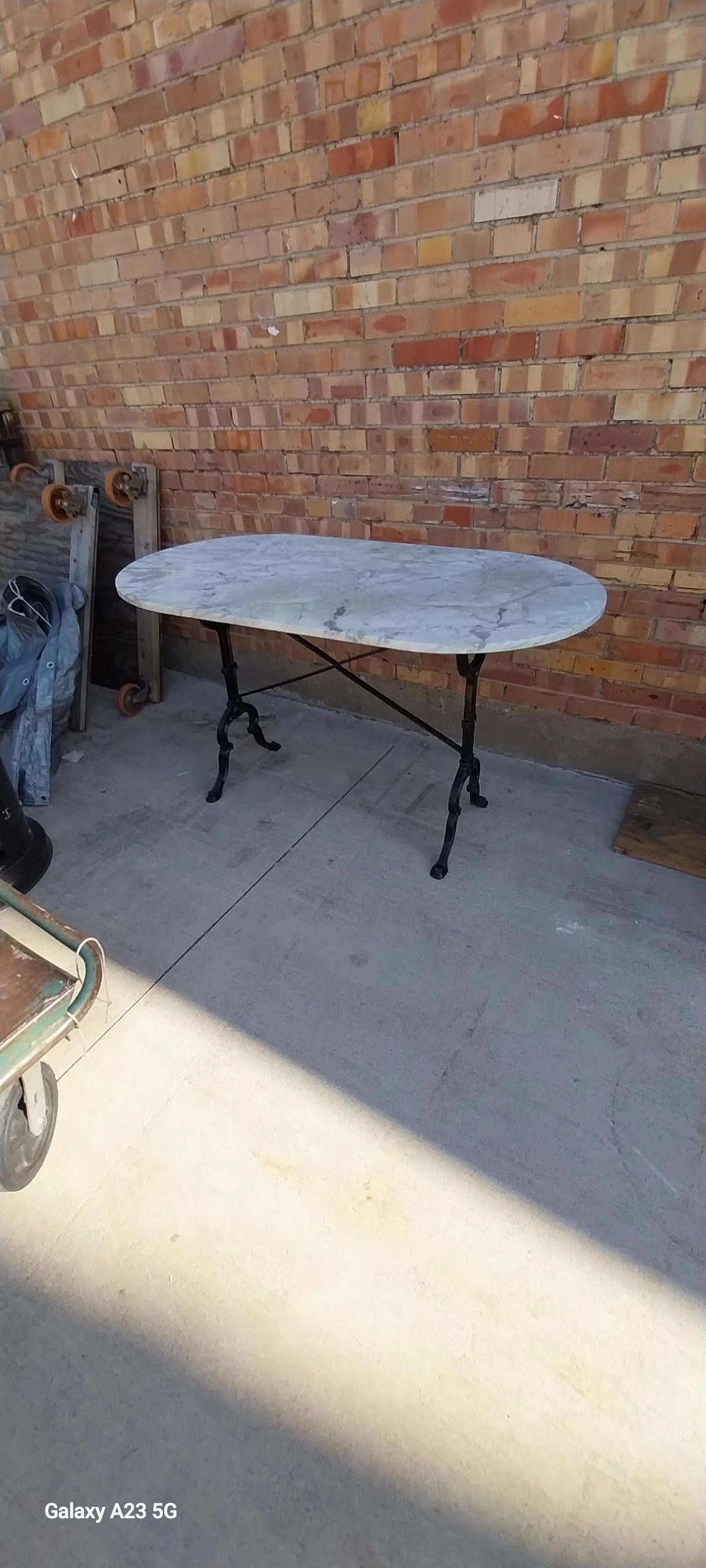 OVAL MARBLE TOP METAL BASE PUB TABLE