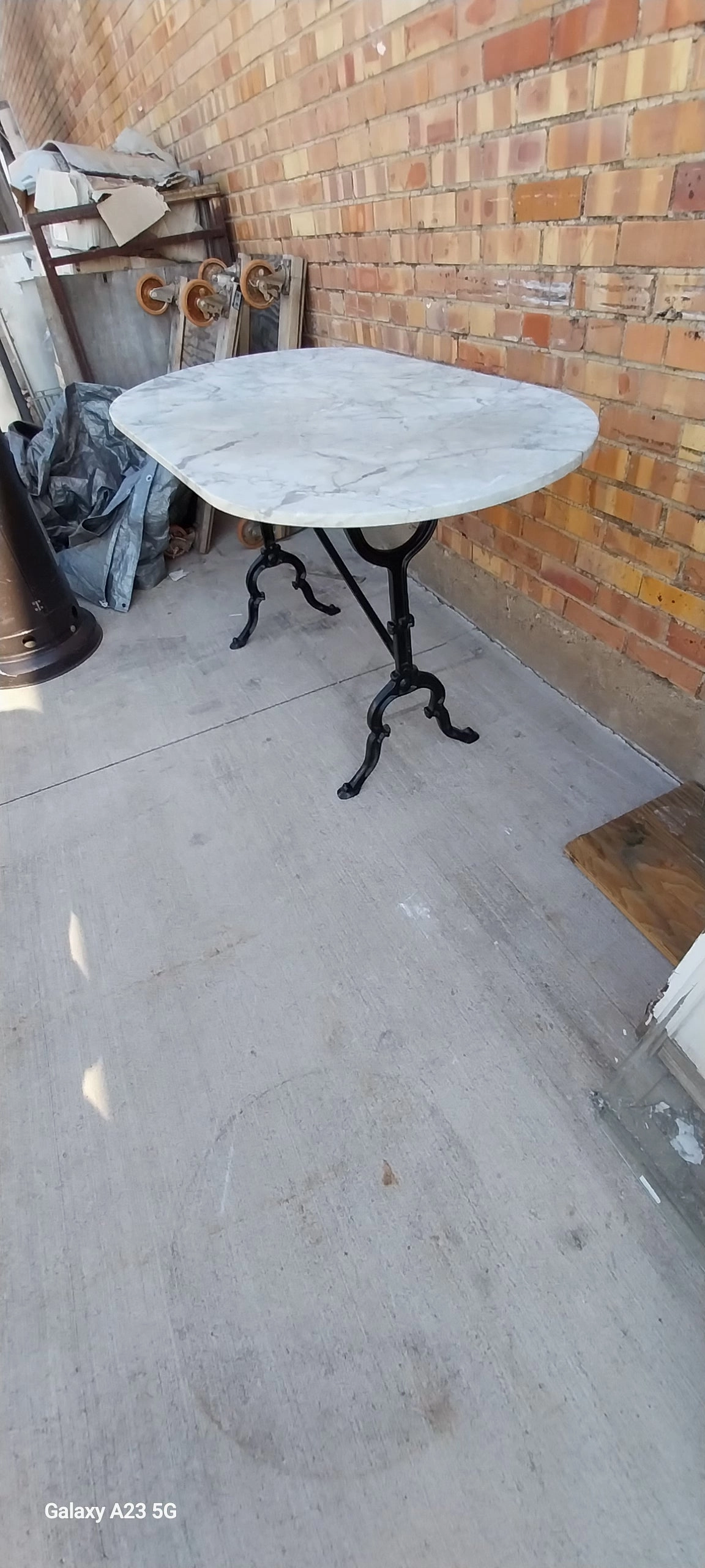 OVAL MARBLE TOP METAL BASE PUB TABLE