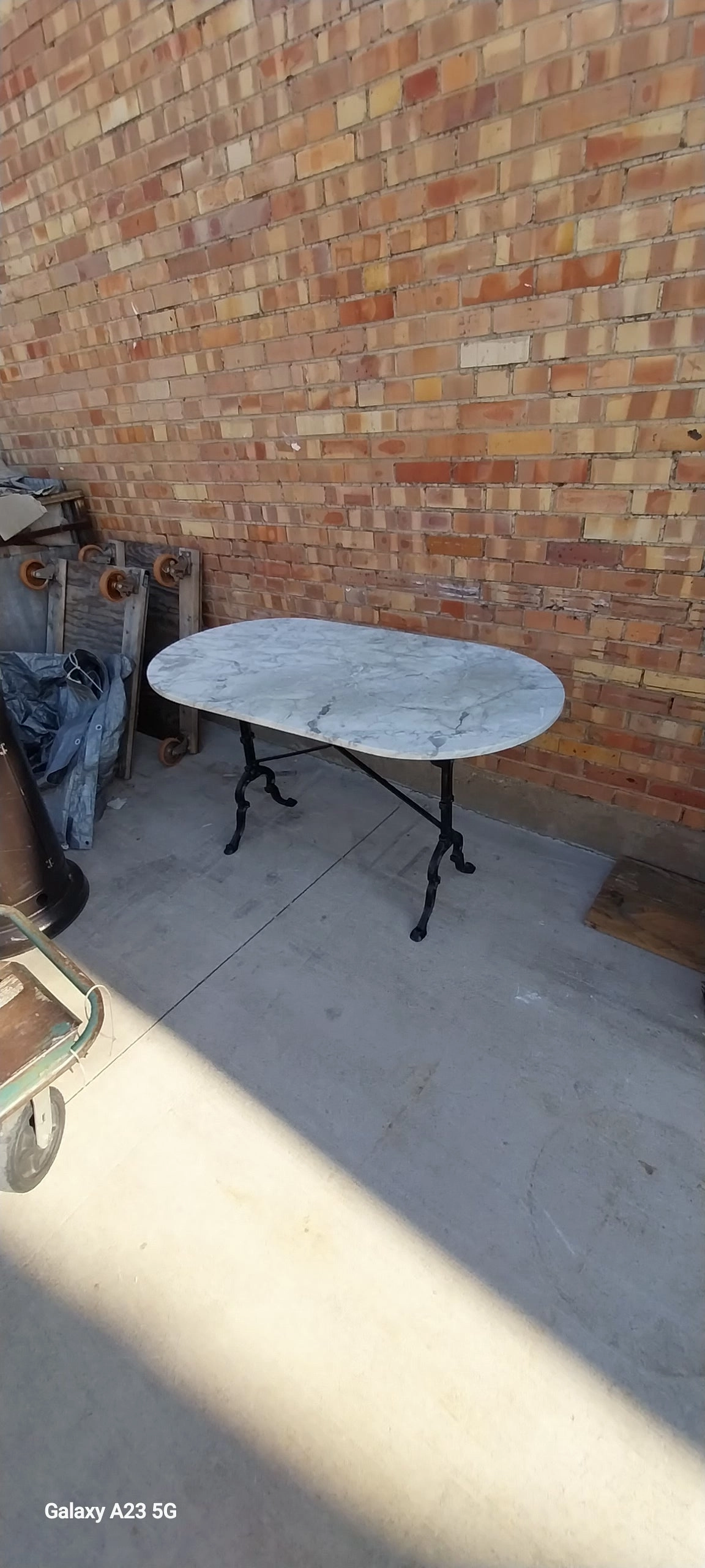 OVAL MARBLE TOP METAL BASE PUB TABLE